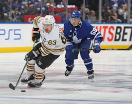Brad Marchand of the Boston Bruins skates with the puck as we look at our favorite Maple Leafs vs. Bruins player props for Game 7