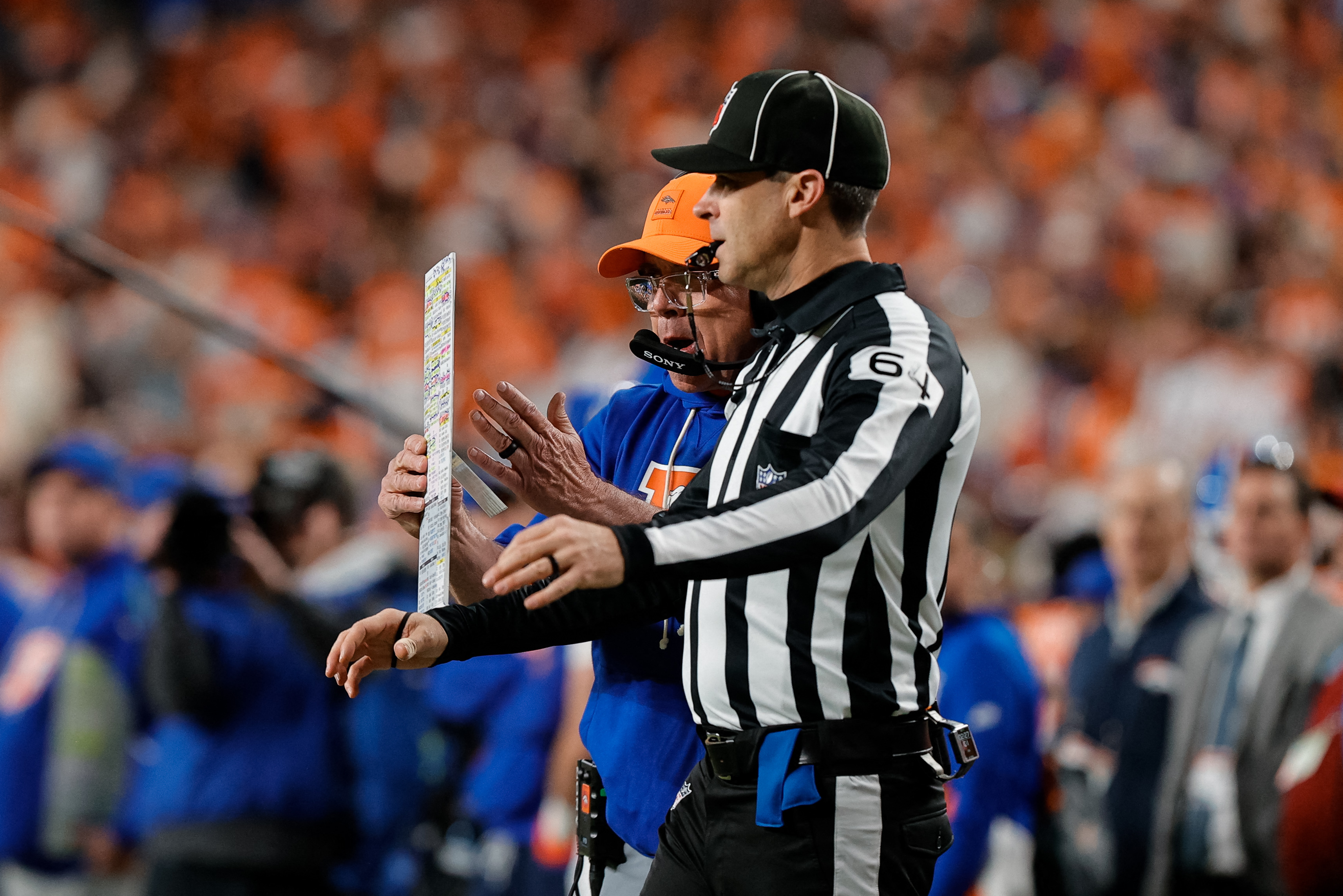 Denver Broncos head coach Sean Payton calls for a timeout with down judge Andy Warner (64) as we look at our AFC Championship Game prop bet sheet