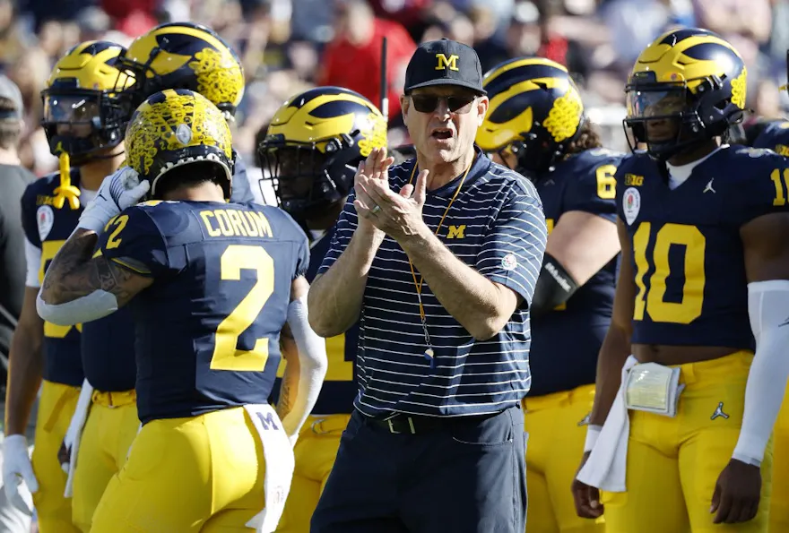 Head coach Jim Harbaugh of the Michigan Wolverines looks on before the CFP Semifinal Rose Bowl Game against the Alabama Crimson Tide as we look at our Michigan-Washington player prop picks.