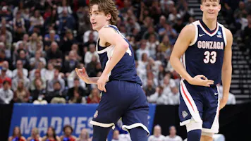 Dusty Stromer #4 and Ben Gregg #33 of the Gonzaga Bulldogs celebrate as we offer our Gonzaga vs. Purdue expert pick and prediction for the Sweet 16 of the 2024 NCAA Tournament on Friday.