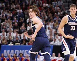 Dusty Stromer #4 and Ben Gregg #33 of the Gonzaga Bulldogs celebrate as we offer our Gonzaga vs. Purdue expert pick and prediction for the Sweet 16 of the 2024 NCAA Tournament on Friday.