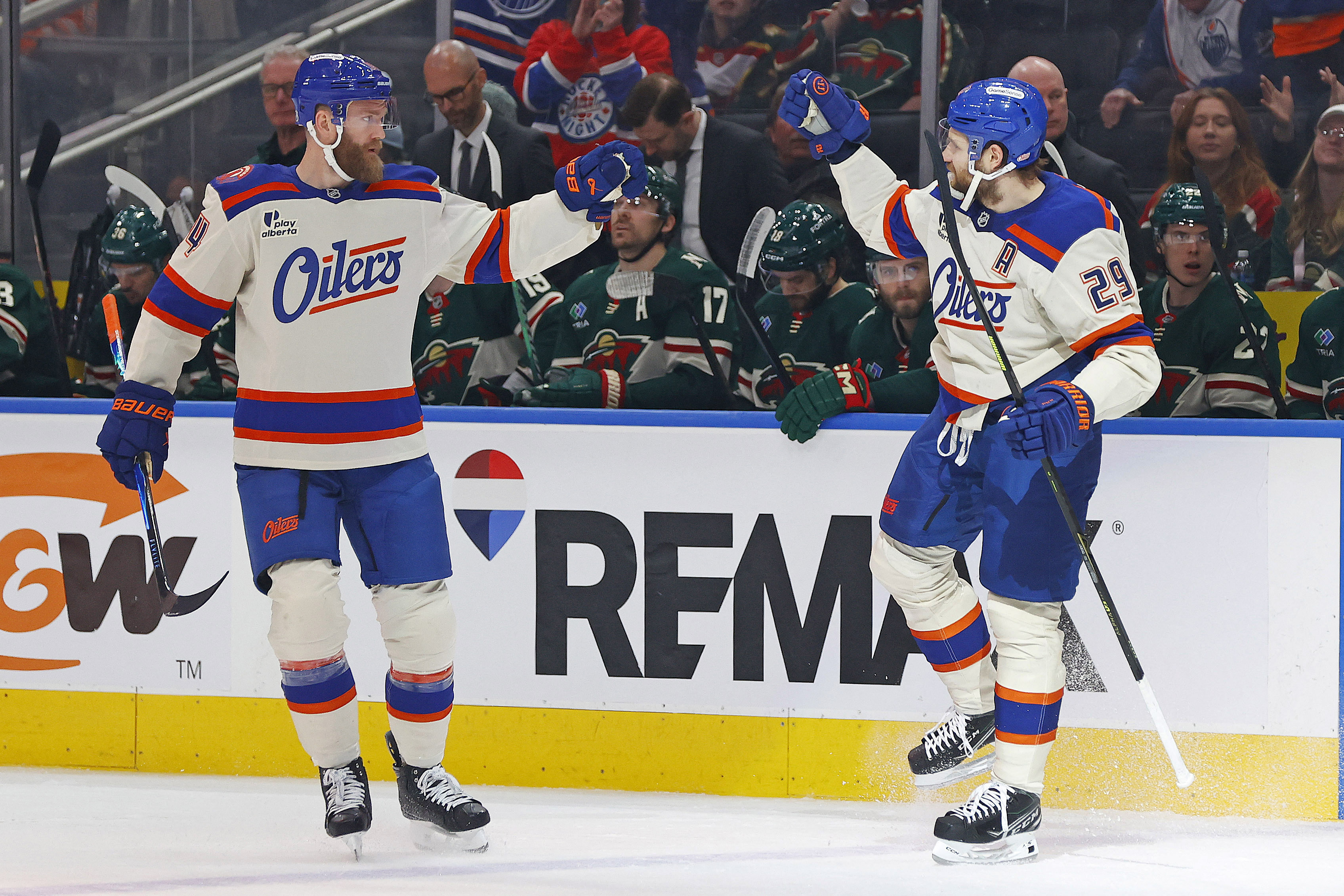 Mattias Ekholm and Leon Draisaitl celebrate an Oilers' goal as we provide our NHL player props and best bets today. 