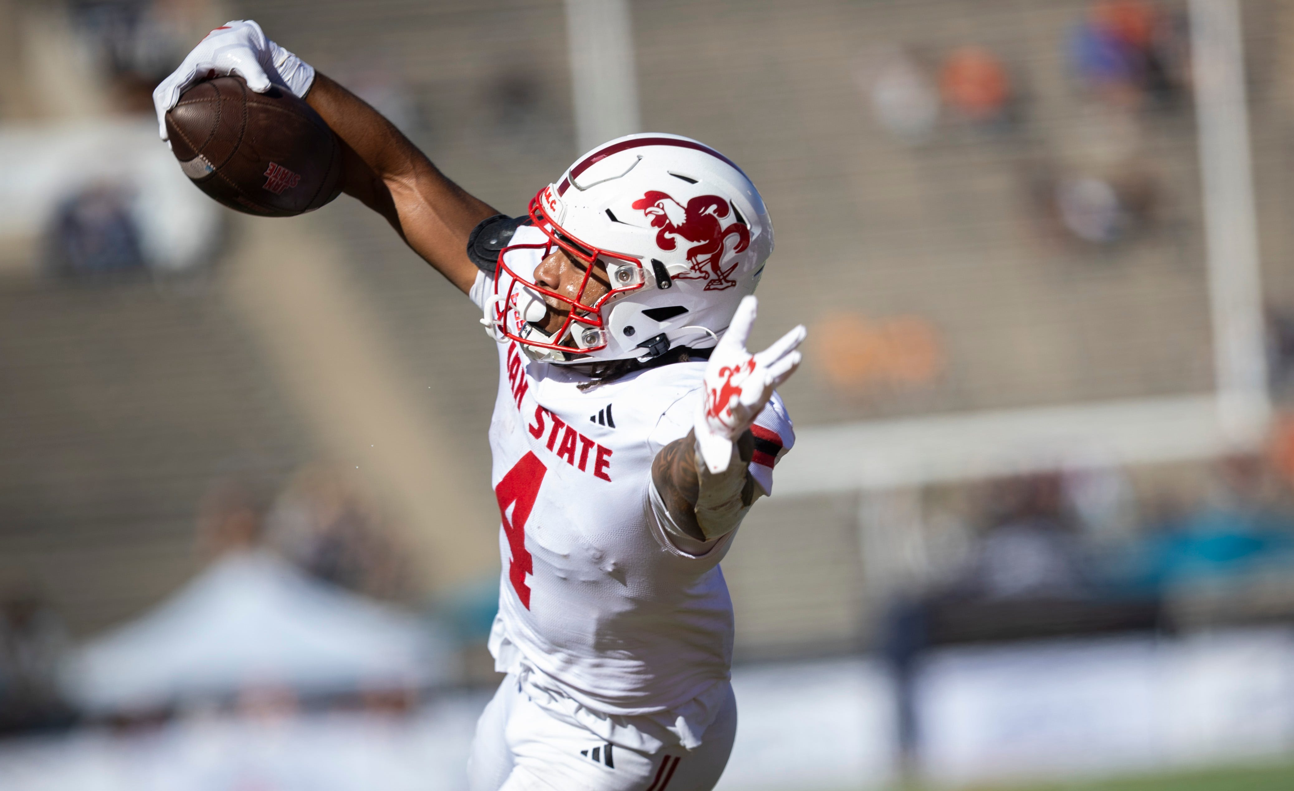 Jacksonville State Gamecocks running back Cam Cook dives in for a touchdown as we make our best Troy vs. Jacksonville State prediction.
