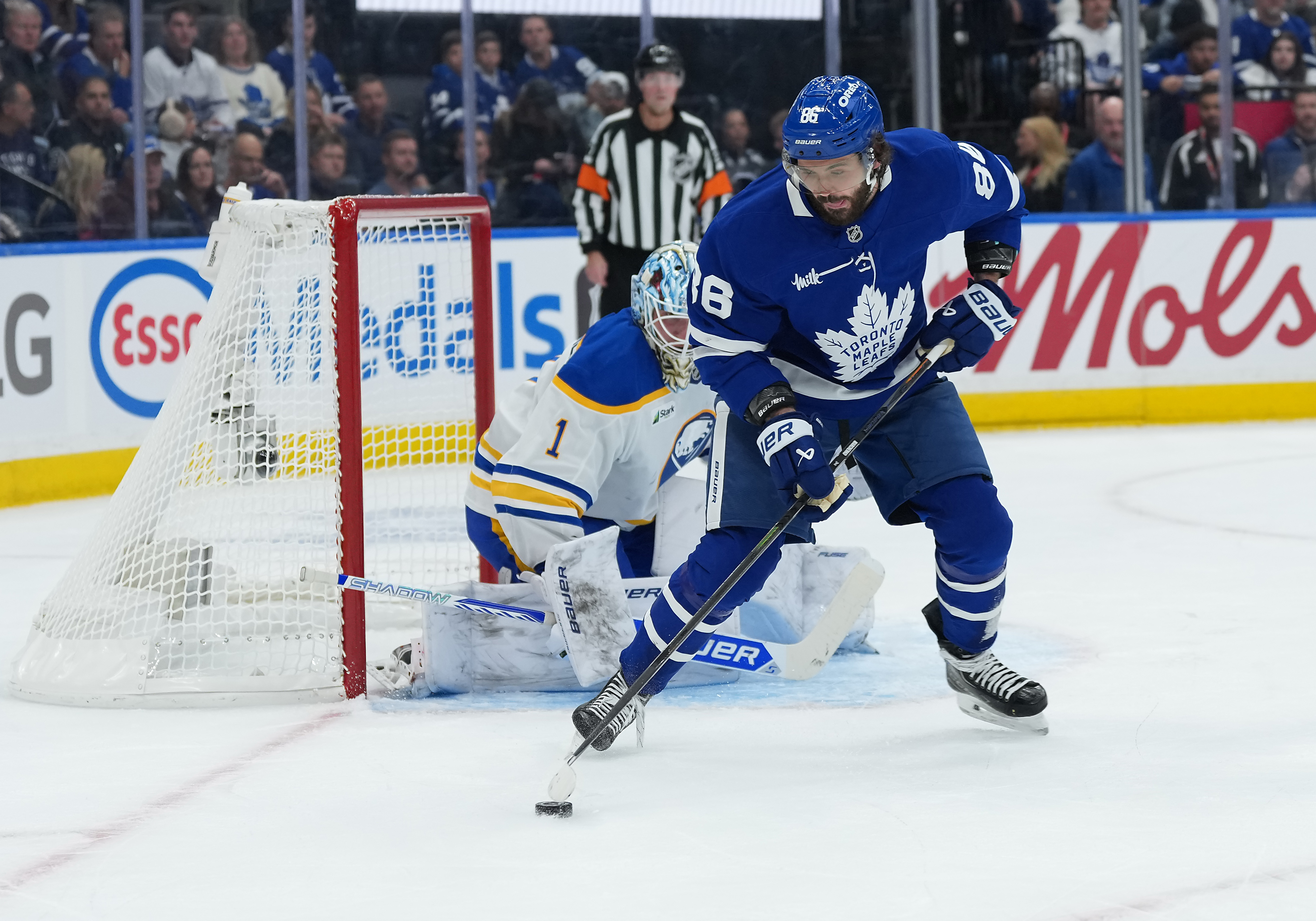Toronto Maple Leafs right wing Kirill Marchenko (86) battles for the puck in front of Buffalo Sabres goaltender Ukko-Pekka Luukkonen as we make our best NHL predictions for Oct. 20.
