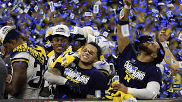 Blake Corum #2 of the Michigan Wolverines celebrates after winning as we look at the college football playoff odds