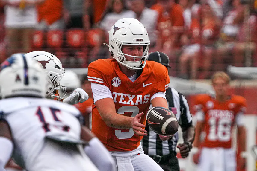 Texas quarterback Quinn Ewers snaps the ball during against UTSA. We look at the top Quinn Ewers Player Prop Bets.