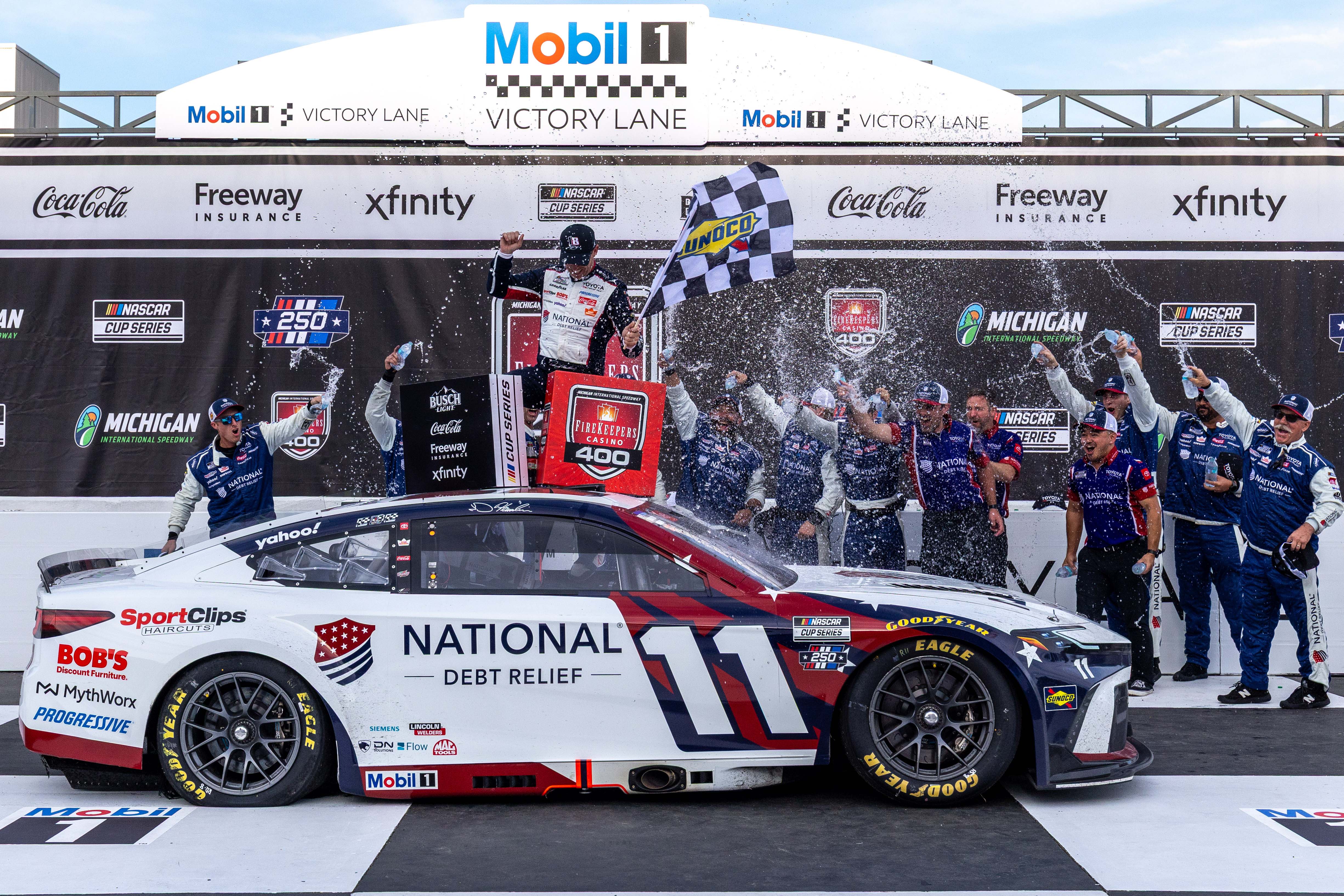 Pictured: Joe Gibbs Racing driver Denny Hamlin (11) after winning as he is featured in our Brickyard 400 predictions &amp; odds 2026.