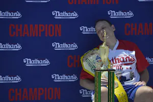 Joey Chestnut eats hot dogs as we look at the 2024 hot dog eating contest odds