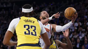Jalen Brunson (11) of the New York Knicks drives past Myles Turner (33) and Aaron Nesmith (23) of the Indiana Pacers, as we offer our Pacers vs. Knicks player props for Game 2 at Madison Square Garden on Wednesday.