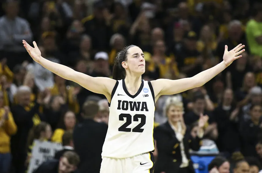 Guard Caitlin Clark of the Iowa Hawkeyes celebrates after drawing a foul late in the second half against the West Virginia Mountaineers, and we offer our top Caitlin Clark props for Colorado vs. Iowa based on the best March Madness odds.