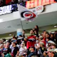 Carolina Hurricanes Storm Crew waves a flag during the third period of a game, and the team has officially partnered with Fanatics Sportsbook.