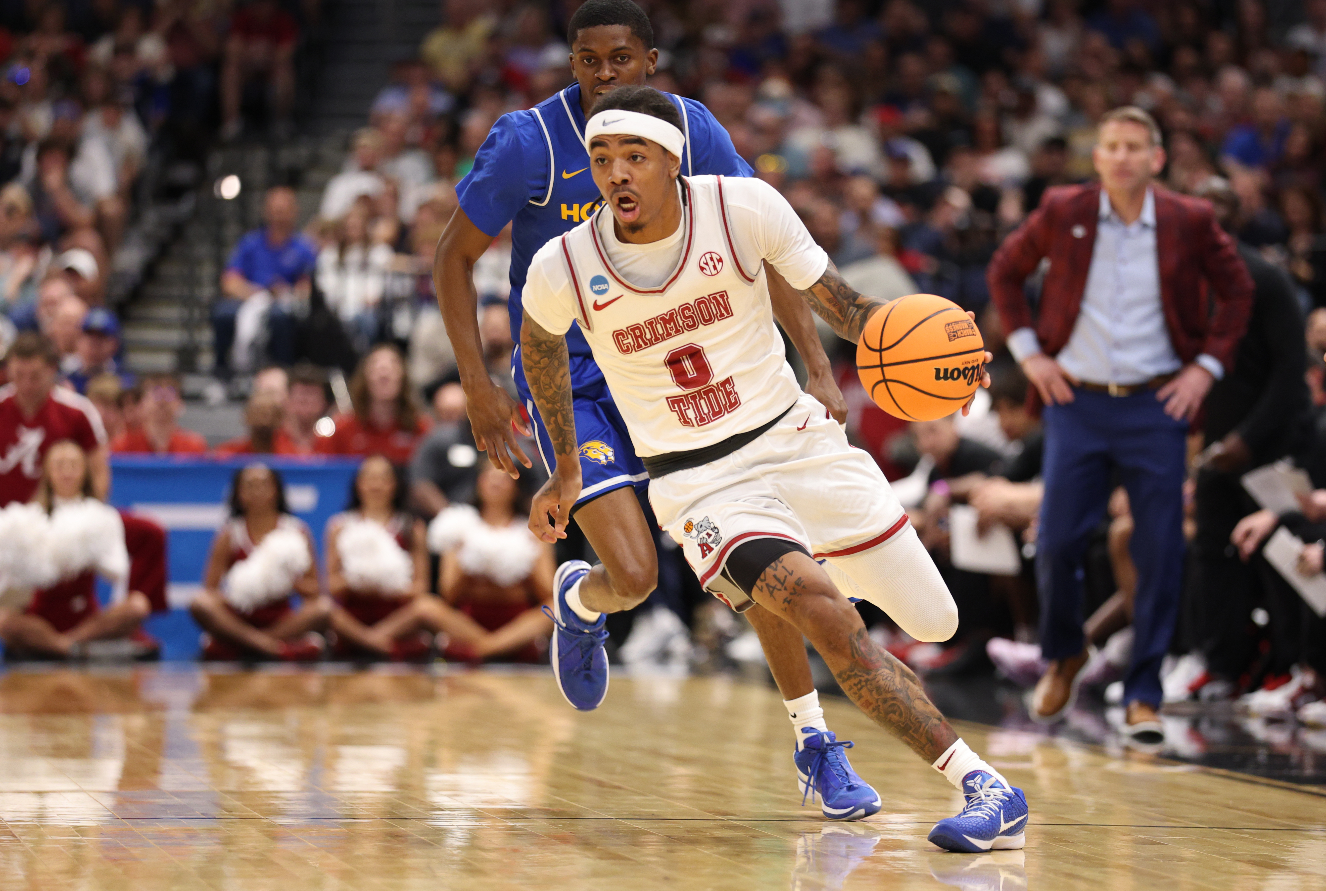 Alabama's Labaron Philon Jr. (0) leads the Crimson Tide in one of eight games covered in our March Madness predictions on Sunday. 