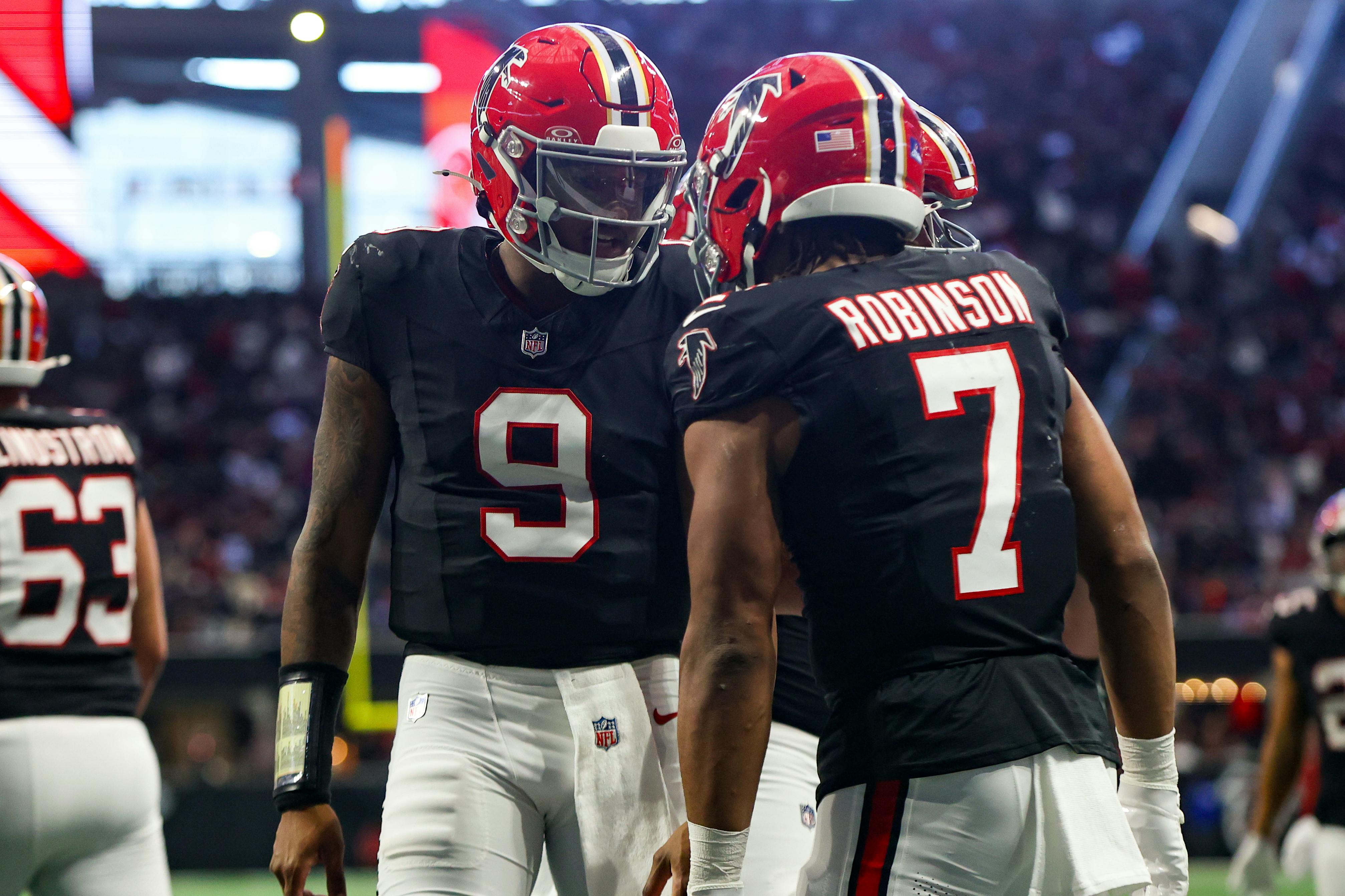 Atlanta Falcons running back Bijan Robinson celebrates after a touchdown with quarterback Michael Penix Jr. as we look at the best NFL odds Week 18. 