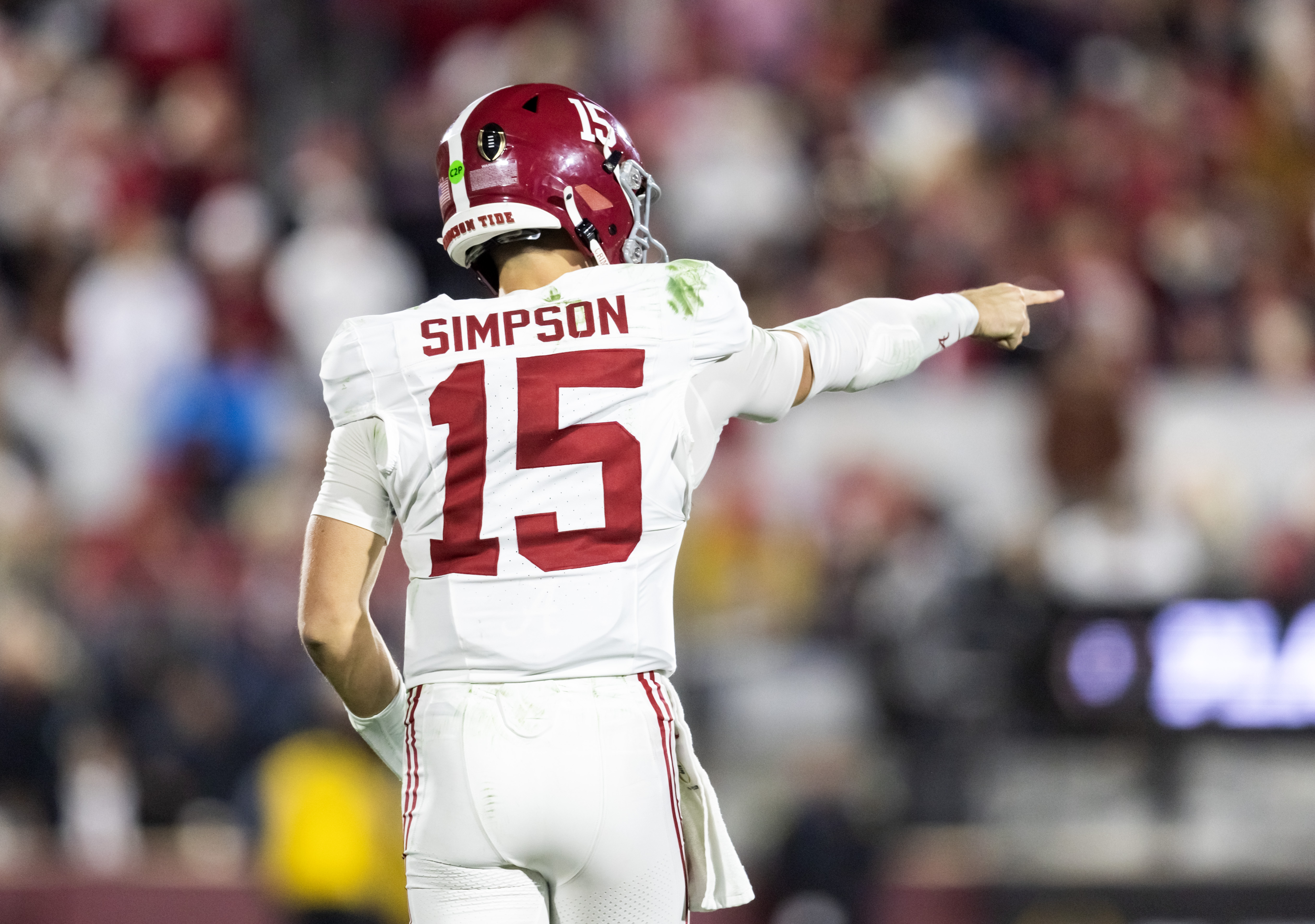 Alabama Crimson Tide quarterback Ty Simpson (15) points against the Oklahoma Sooners in the CFP National Playoff First Round at Gaylord Family Oklahoma Memorial Stadium.