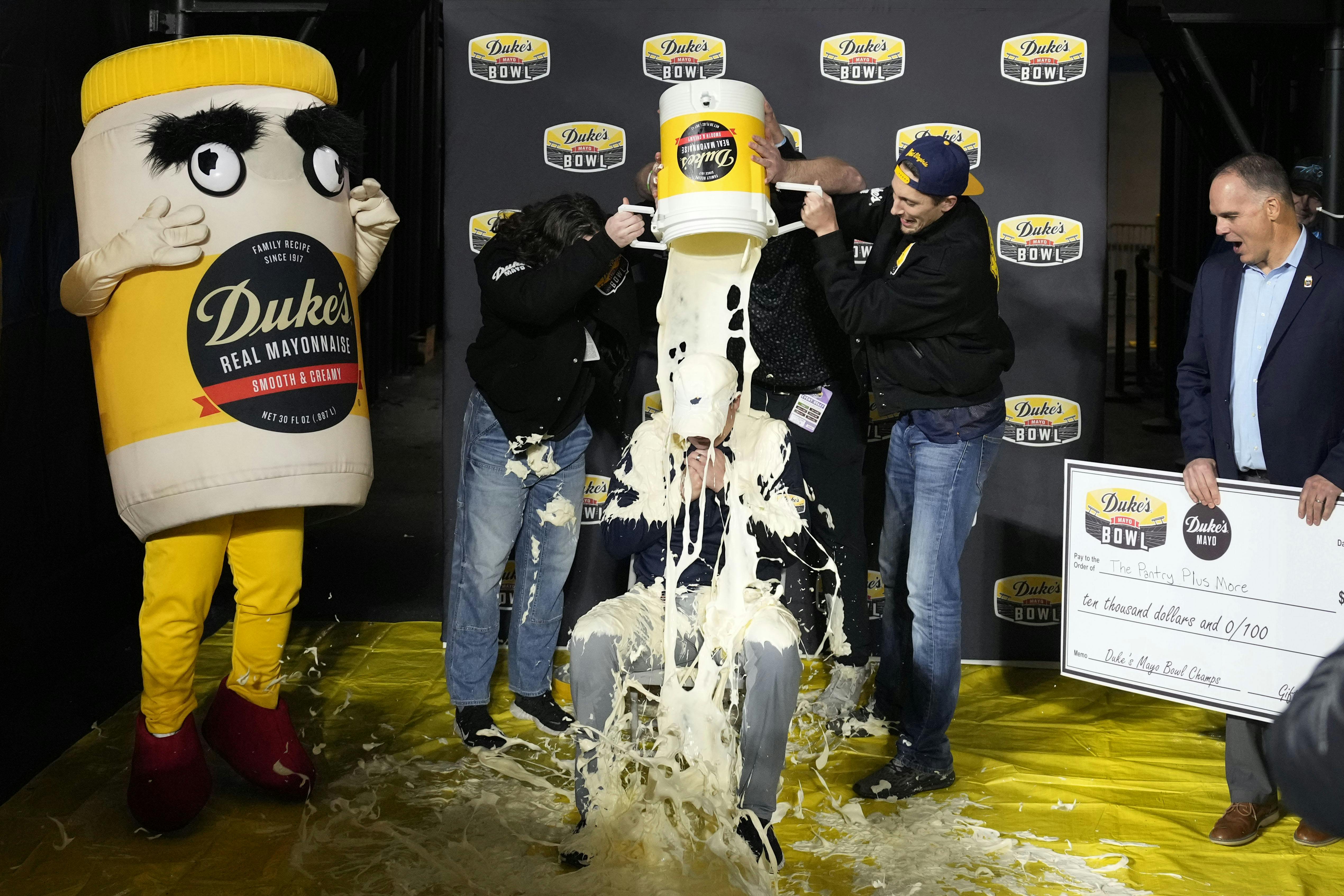 West Virginia Mountaineers head coach Neal Brown gets covered in mayonnaise as we look at the college football bowl game odds.