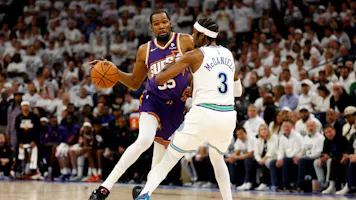 Kevin Durant (35) of the Phoenix Suns drives to the basket against Jaden McDaniels (3) of the Minnesota Timberwolves, as we offer our best Timberwolves vs. Suns player props for Game 3 on Friday.