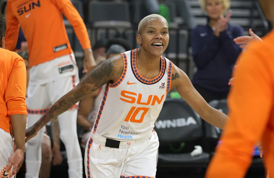 Courtney Williams of the Connecticut Sun is greeted by teammates before a game against the Las Vegas Ace.