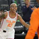 Courtney Williams of the Connecticut Sun is greeted by teammates before a game against the Las Vegas Ace.