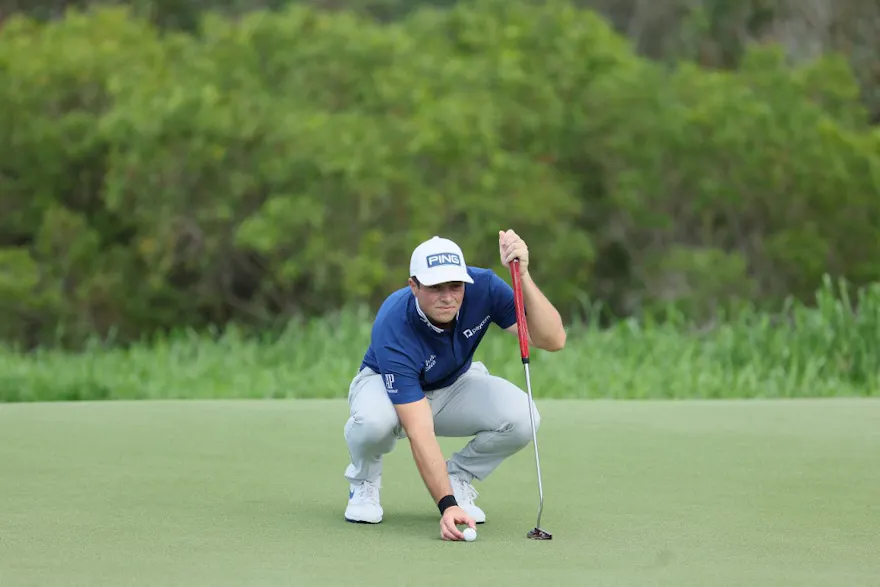 Viktor Hovland of Norway lines up a putt on the fourth hole during the first round of the Sentry Tournament of Champions at Plantation Course at Kapalua Golf Club on January 05, 2023 in Lahaina, Hawaii.