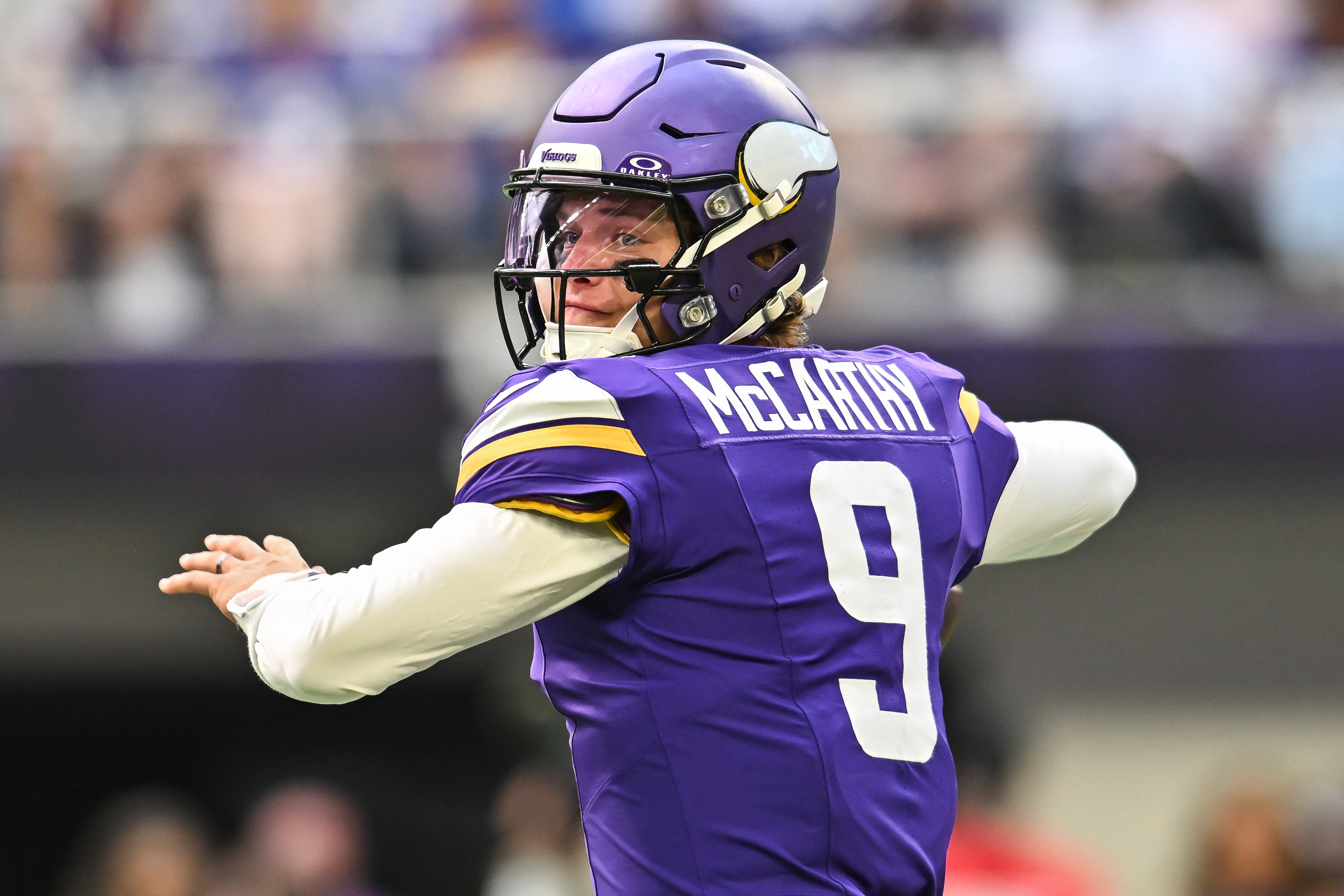 Minnesota Vikings quarterback J.J. McCarthy (9) looks to throw a pass as he is featured in our Vikings vs. Broncos prediction.