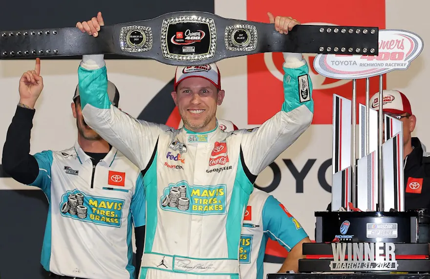 Denny Hamlin, driver of the #11 Mavis Tires & Brakes Toyota, celebrates in victory lane as we look at the latest 2024 NASCAR Cup Series championship odds.