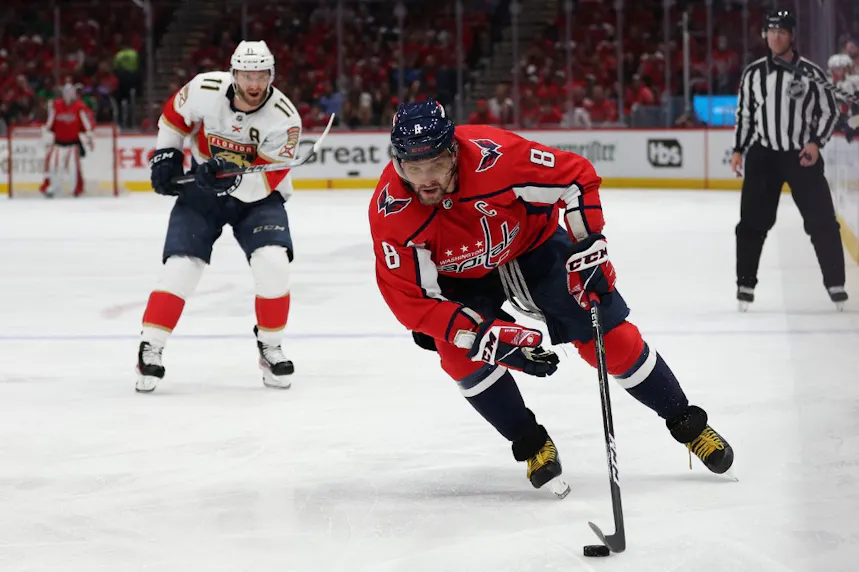 Alex Ovechkin of the Washington Capitals skates past Aaron Ekblad of the Florida Panthers.