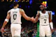 Jaylen Brown (7) of the Boston Celtics celebrates with Jayson Tatum (0), as we round up the 2024 NBA Finals consensus picks and expert predictions ahead of Game 1 on Thursday at TD Garden in Boston.