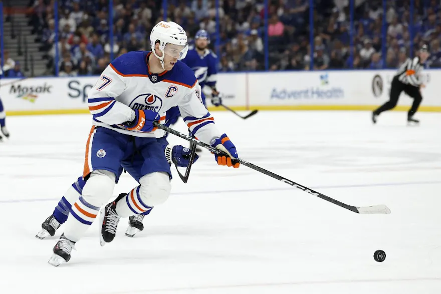Connor McDavid of the Edmonton Oilers looks to pass during a game against the Tampa Bay Lightning at Amalie Arena on November 08, 2022 in Tampa, Florida.