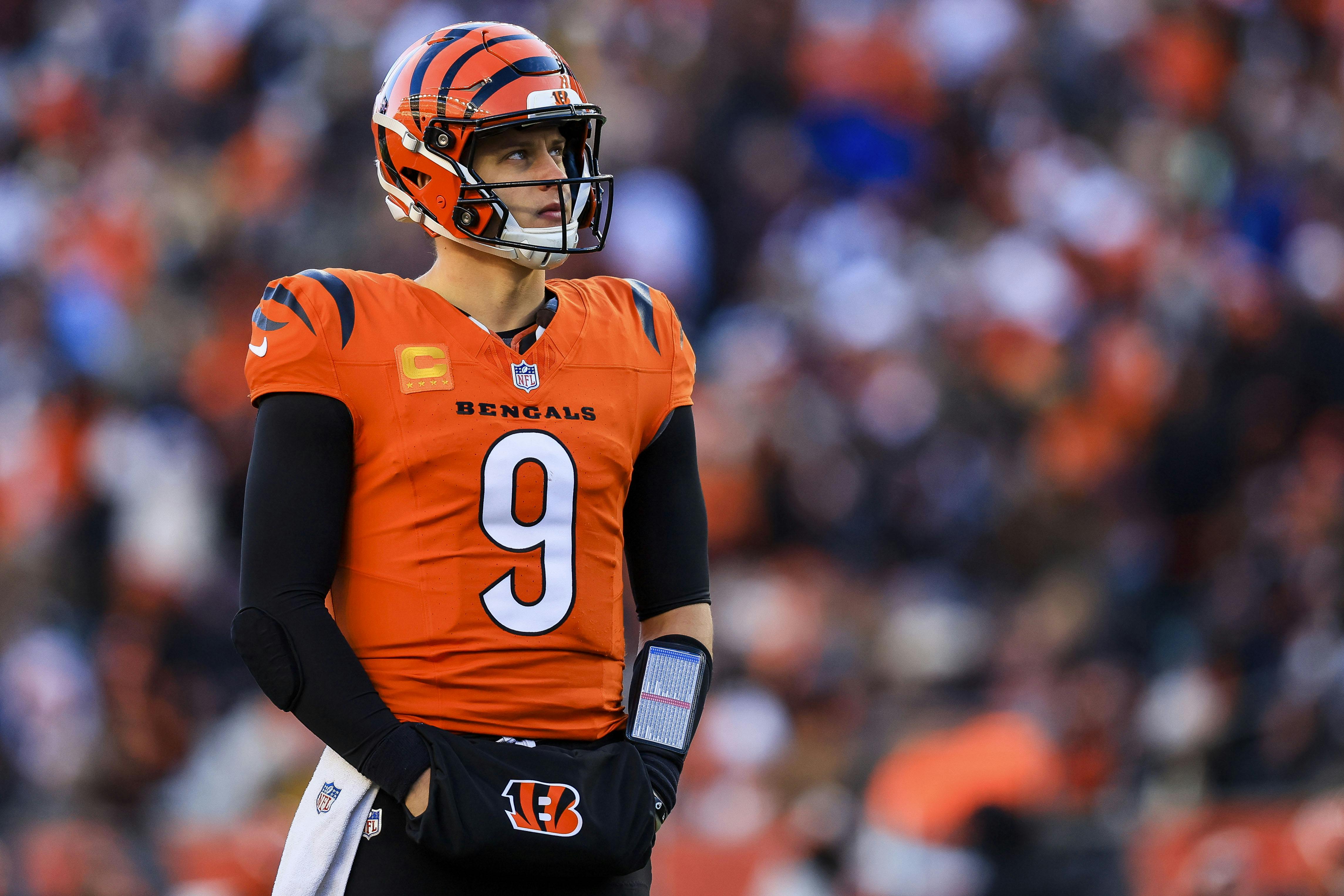 Cincinnati Bengals quarterback Joe Burrow stands on the field against the Pittsburgh Steelers, and he