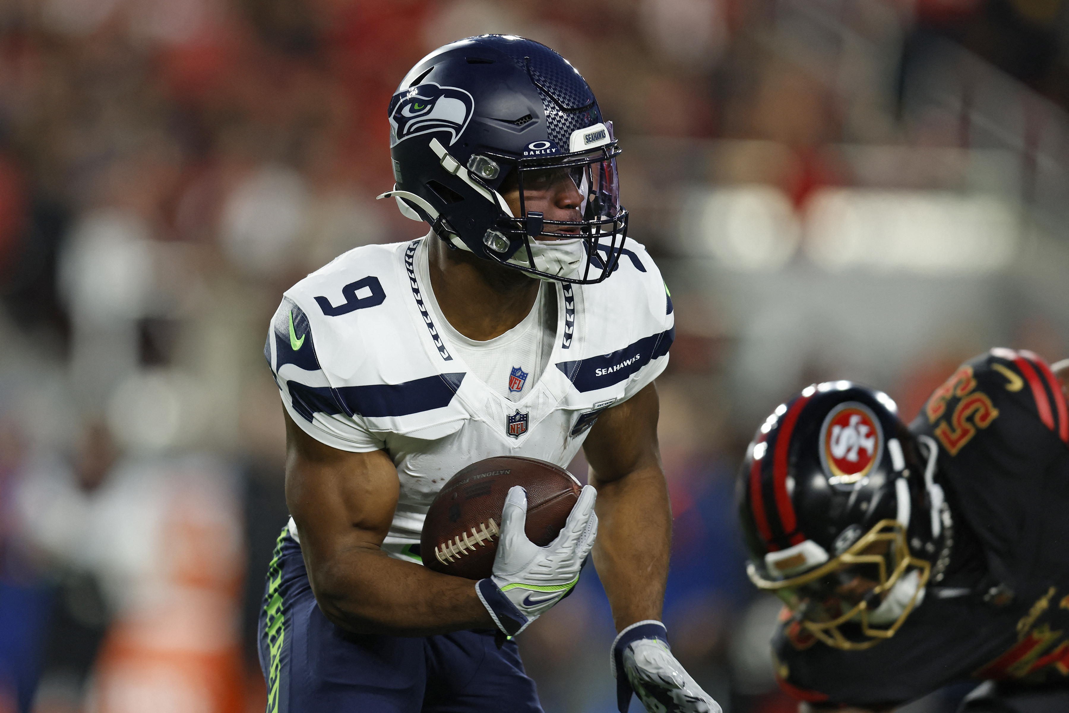 Seattle Seahawks running back Kenneth Walker III (9) rushes the ball against the San Francisco 49ers during as we break down our NFL Divisional Round predictions.
