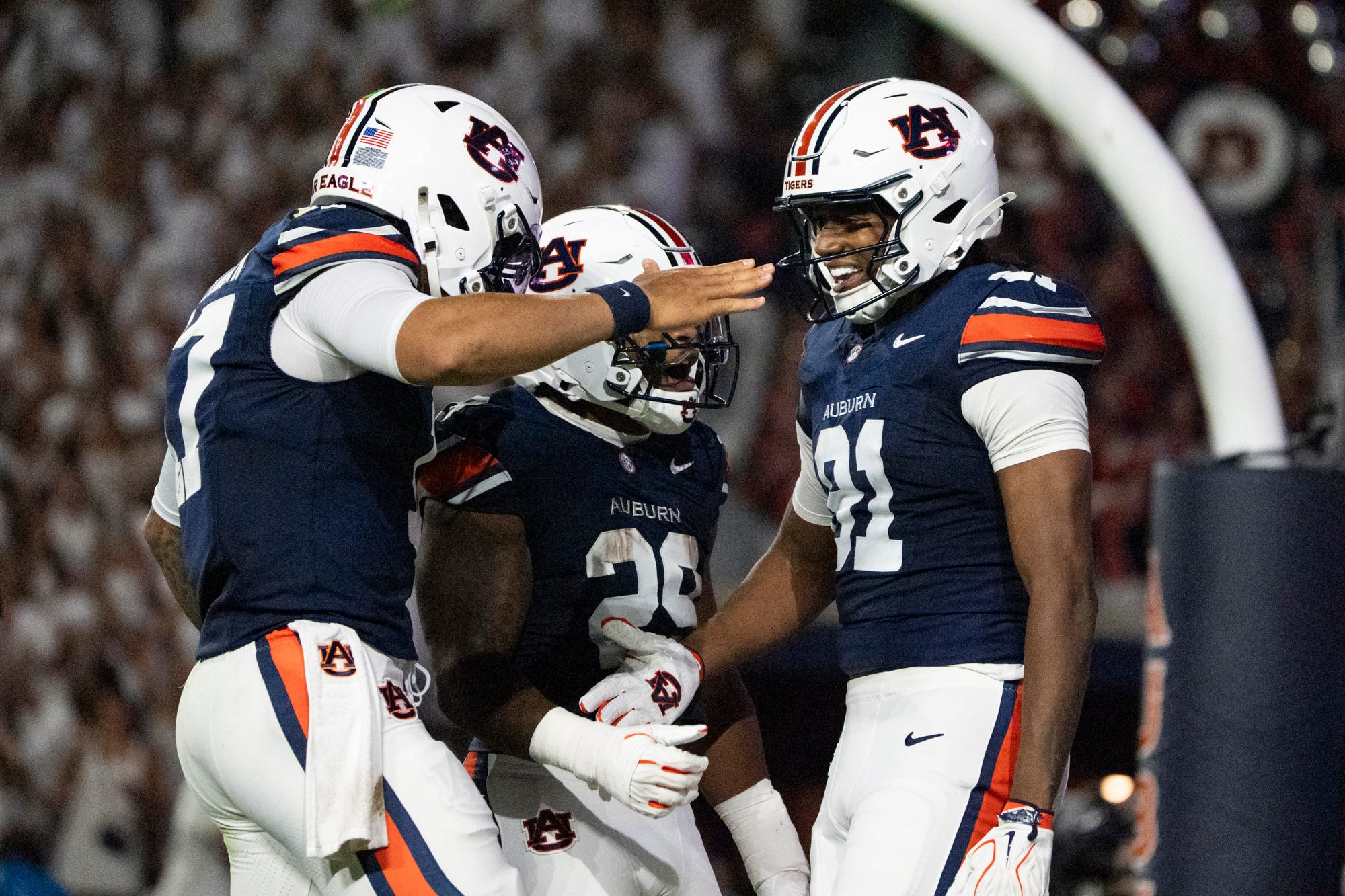 Auburn quarterback Byrum Brown (17) and tight end Jonathan Echols (81) celebrate as we break down our Auburn vs. Tennessee prediction.
