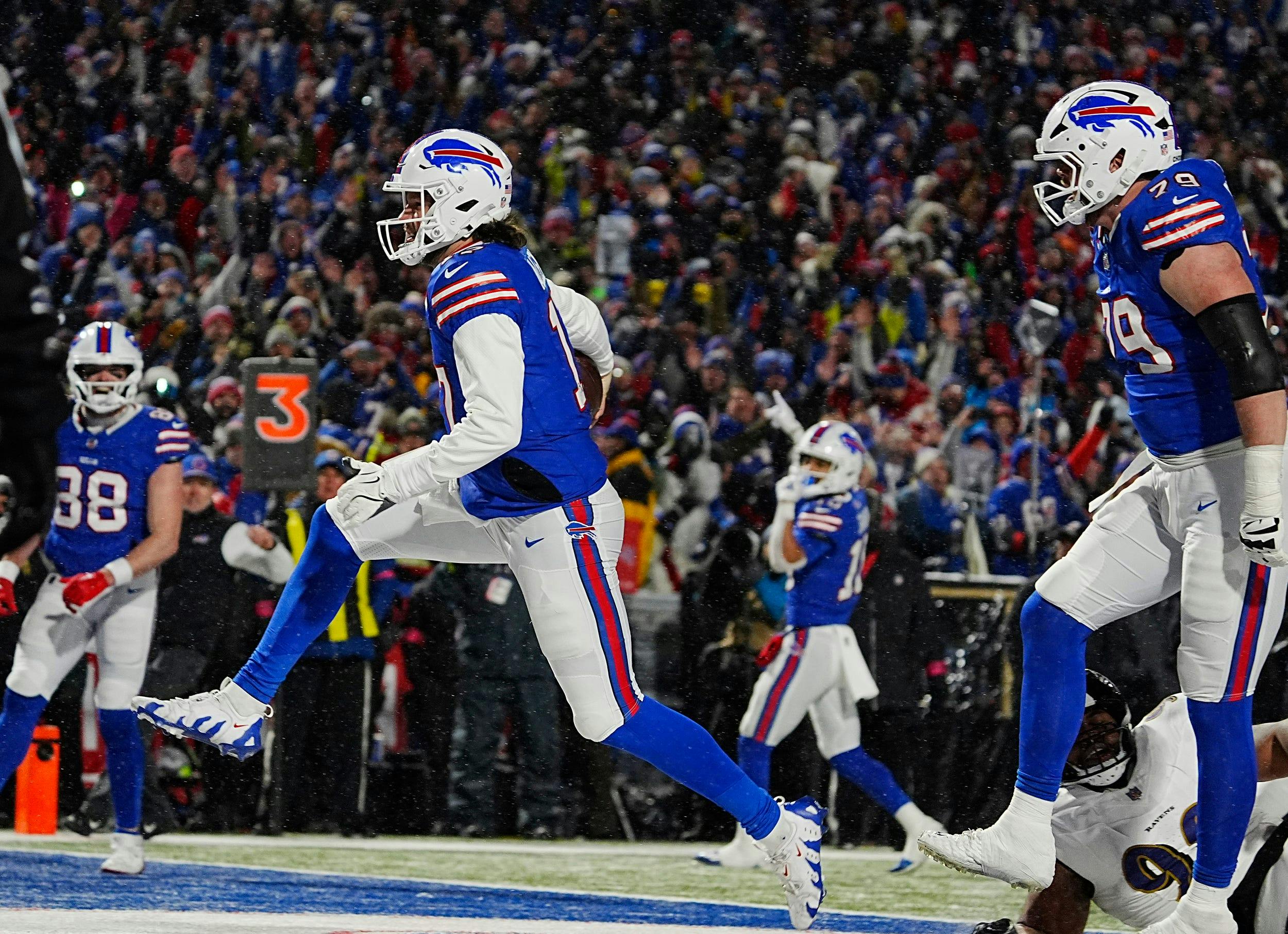 Buffalo Bills quarterback Josh Allen celebrates his touchdown run against the Baltimore Ravens as we dive into our Allen vs. Mahomes comparison.