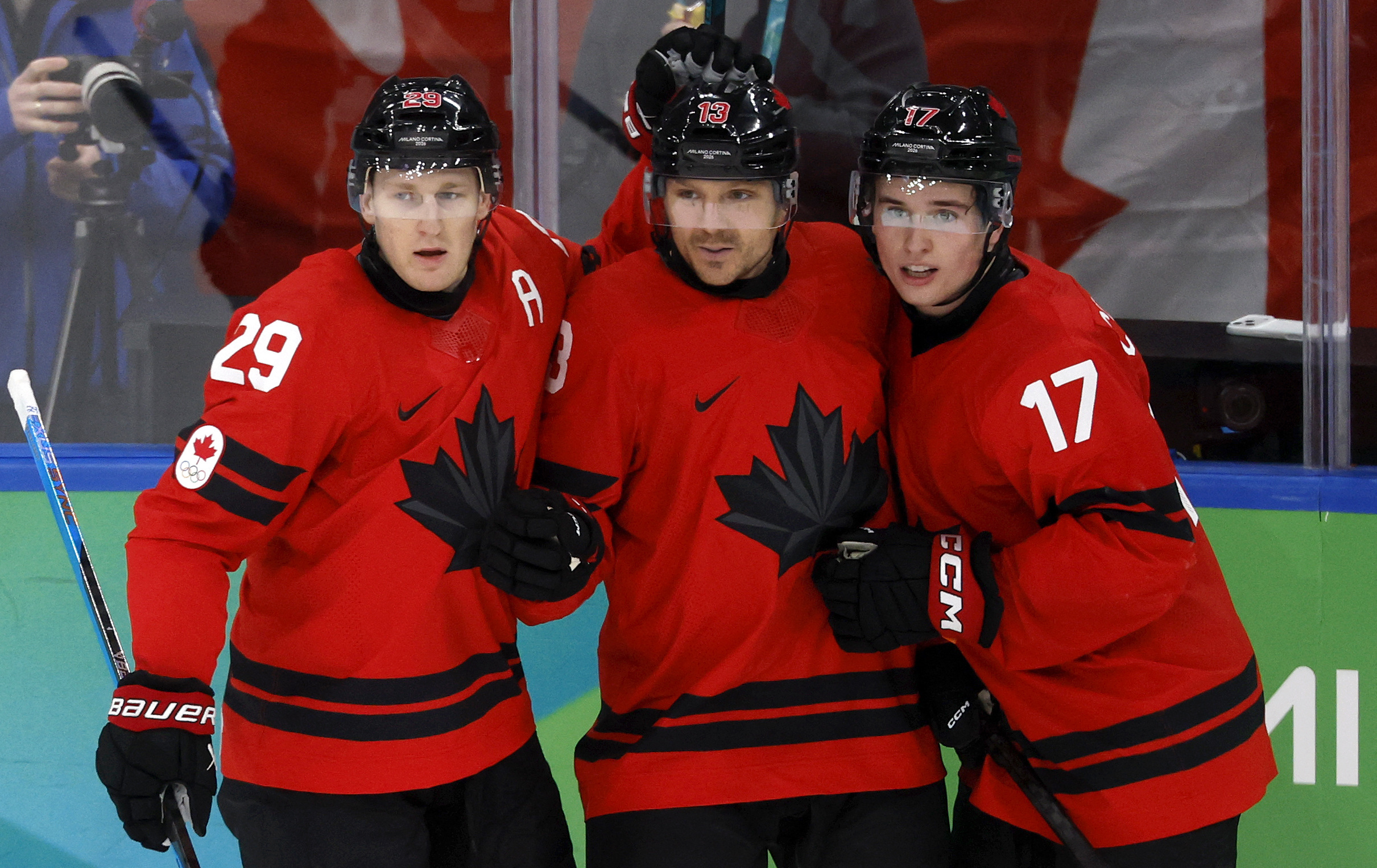 Nathan MacKinnon, Sam Reinhart, and Macklin Celebrini celebrate a goal as we offer our Canada vs. USA goal-scorer predictions.