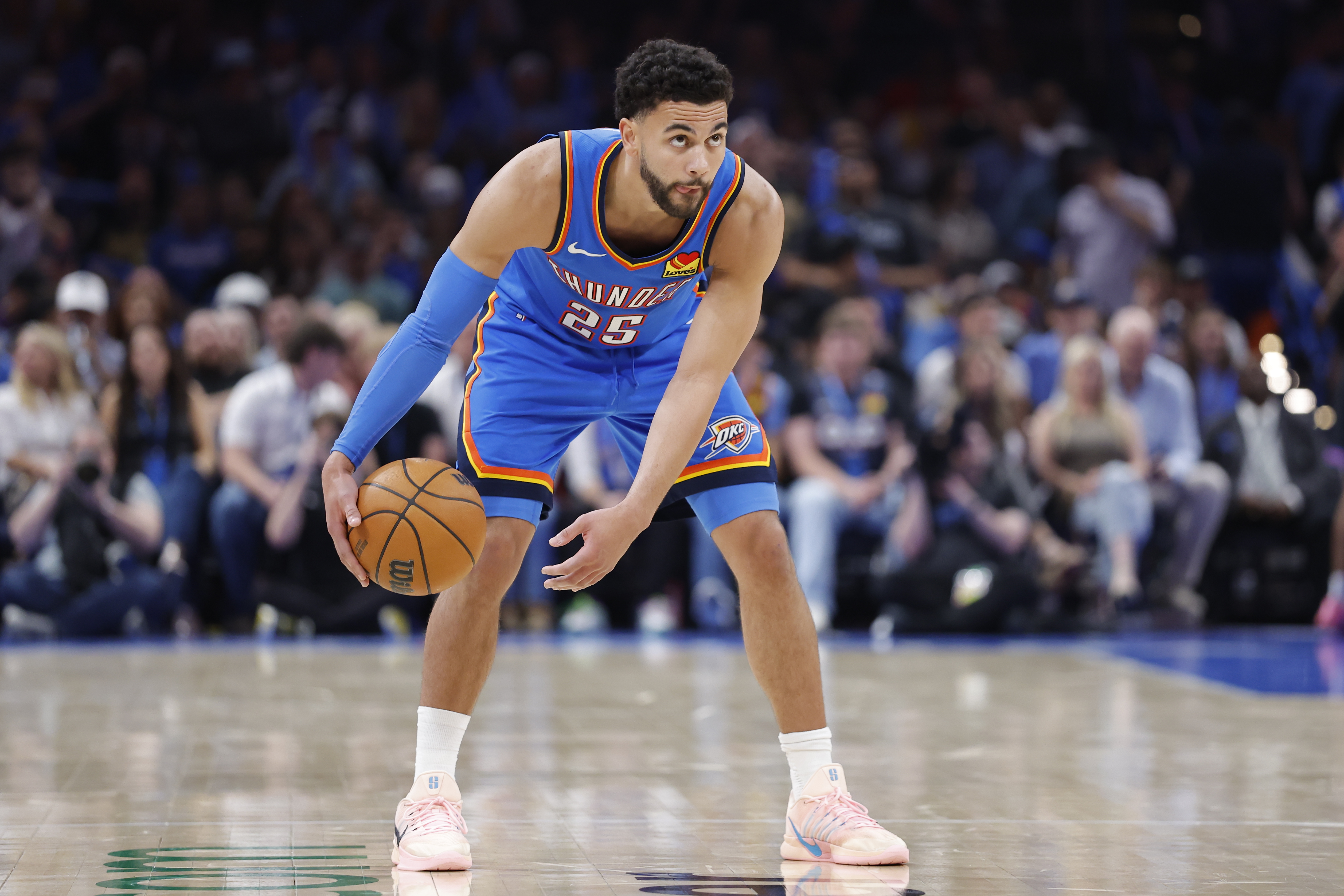 Oklahoma City Thunder guard Ajay Mitchell (25) dribbles down the court as he is featured in our Suns vs. Thunder player props.