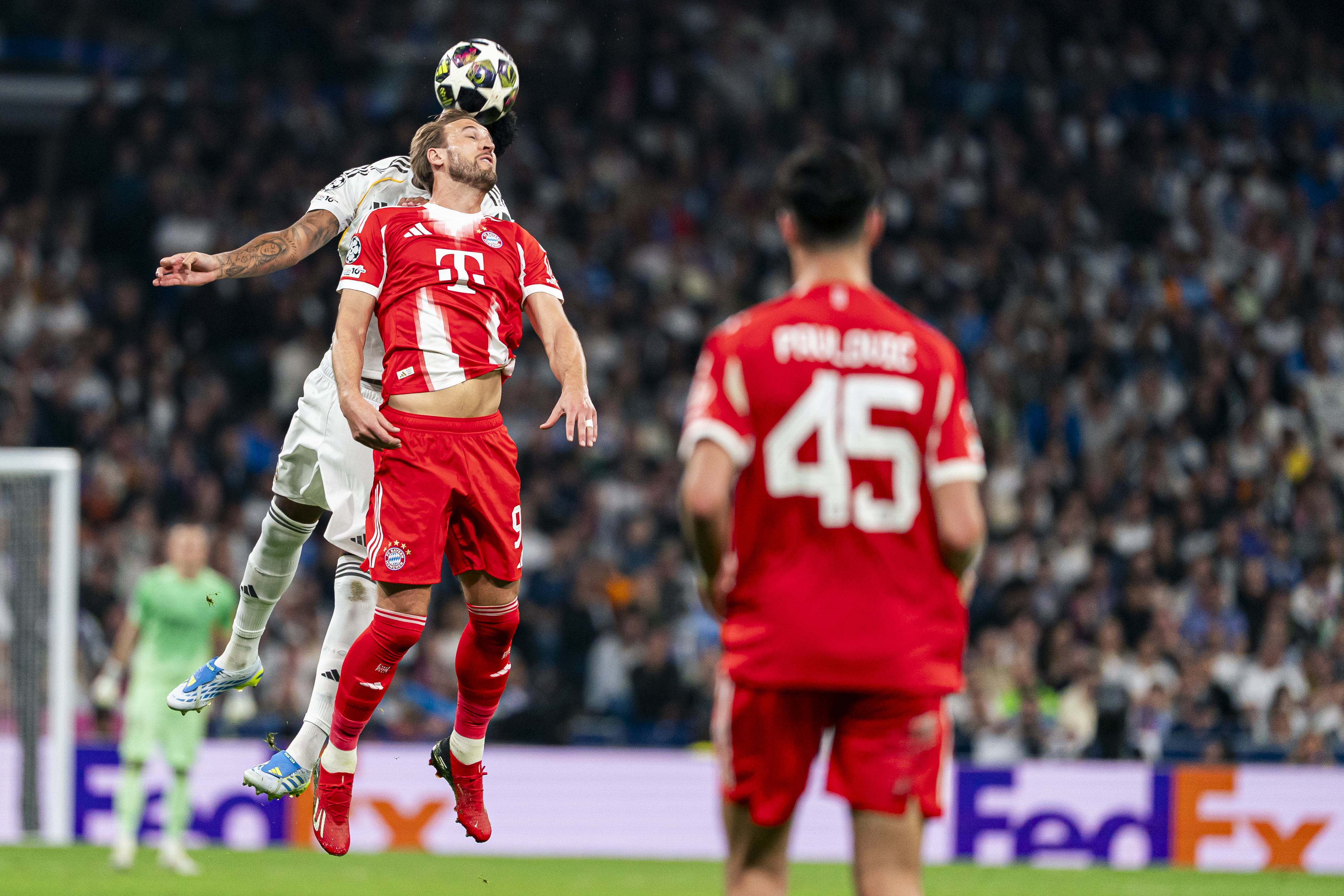 Real Madrid CF's Eder Militao and Bayern Munich’s Harry Kane duel as we make our best Bayern Munich vs. Real Madrid predictions.