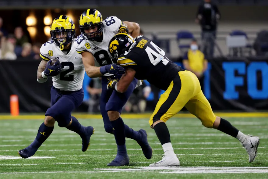 Blake Corum #2 of the Michigan Wolverines runs with the ball in the third quarter against the Iowa Hawkeyes during the Big Ten Championship game at Lucas Oil Stadium on Dec. 04, 2021.