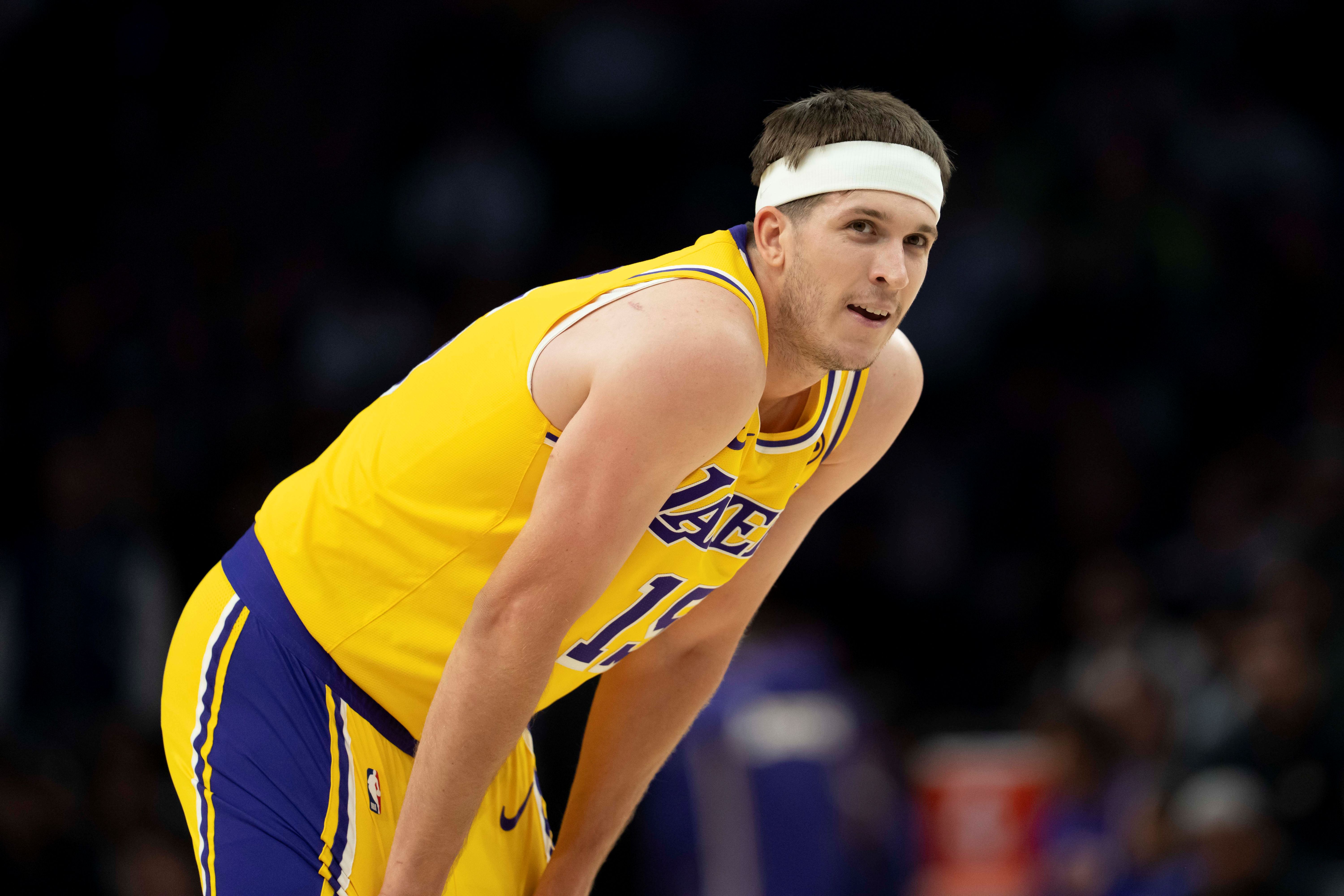 Los Angeles Lakers guard Austin Reaves (15), seen here looking on during a game, is featured in our NBA player props today.