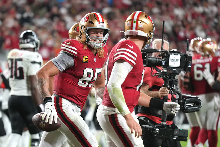San Francisco 49ers tight end George Kittle (center left) celebrates with quarterback Mac Jones (center right) after a touchdown as we look at our National Tight Ends Day anytime touchdown scorer predictions