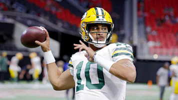 Jordan Love of the Green Bay Packers warms up before the game against the Atlanta Falcons at Mercedes-Benz Stadium as we look at our Lions-Packers DraftKings promo code.