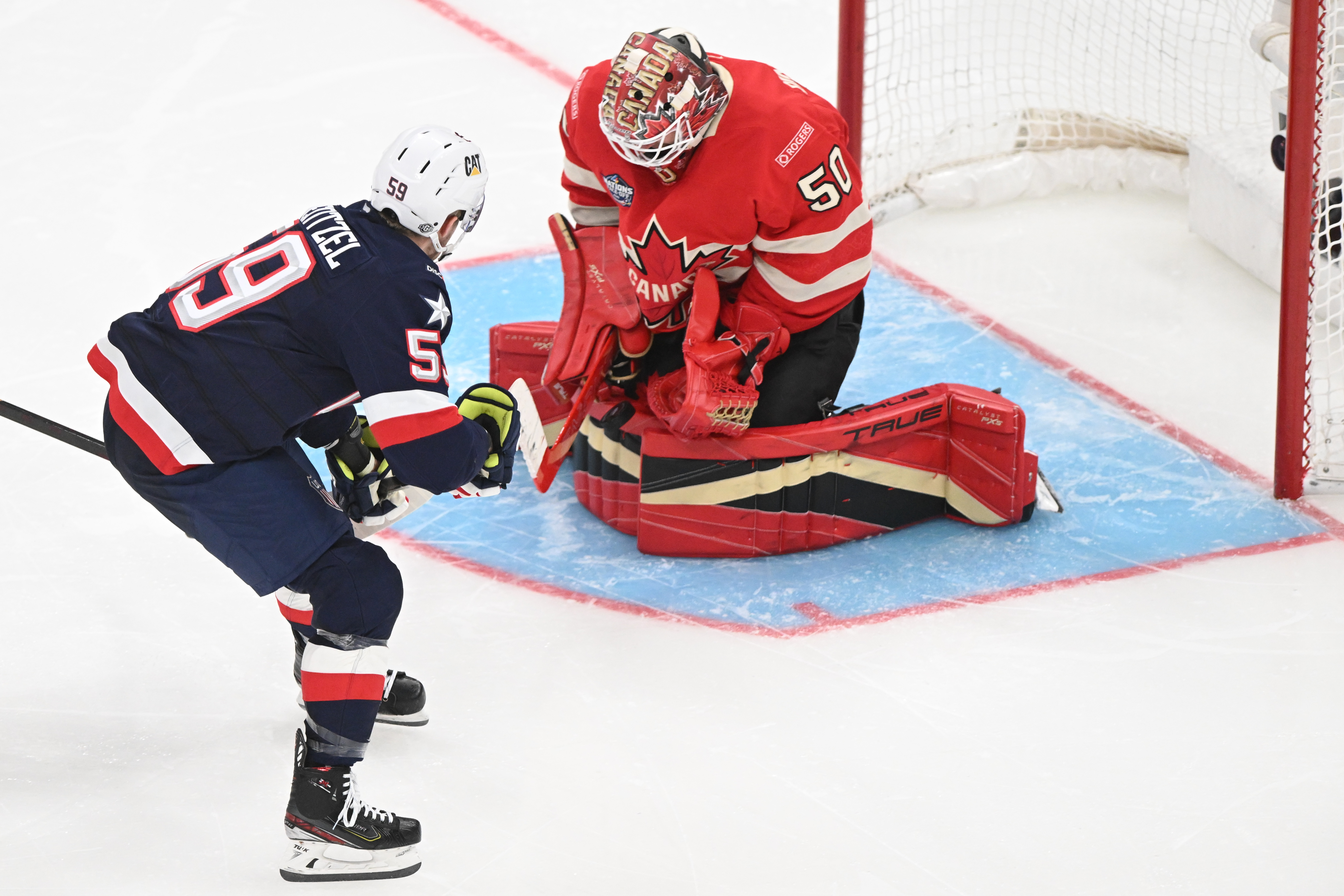 Team Canada goaltender Jordan Binnington - who's featured in my Men's Olympic X-factors - defends against a shot by Team USA forward Jake Guentzel.