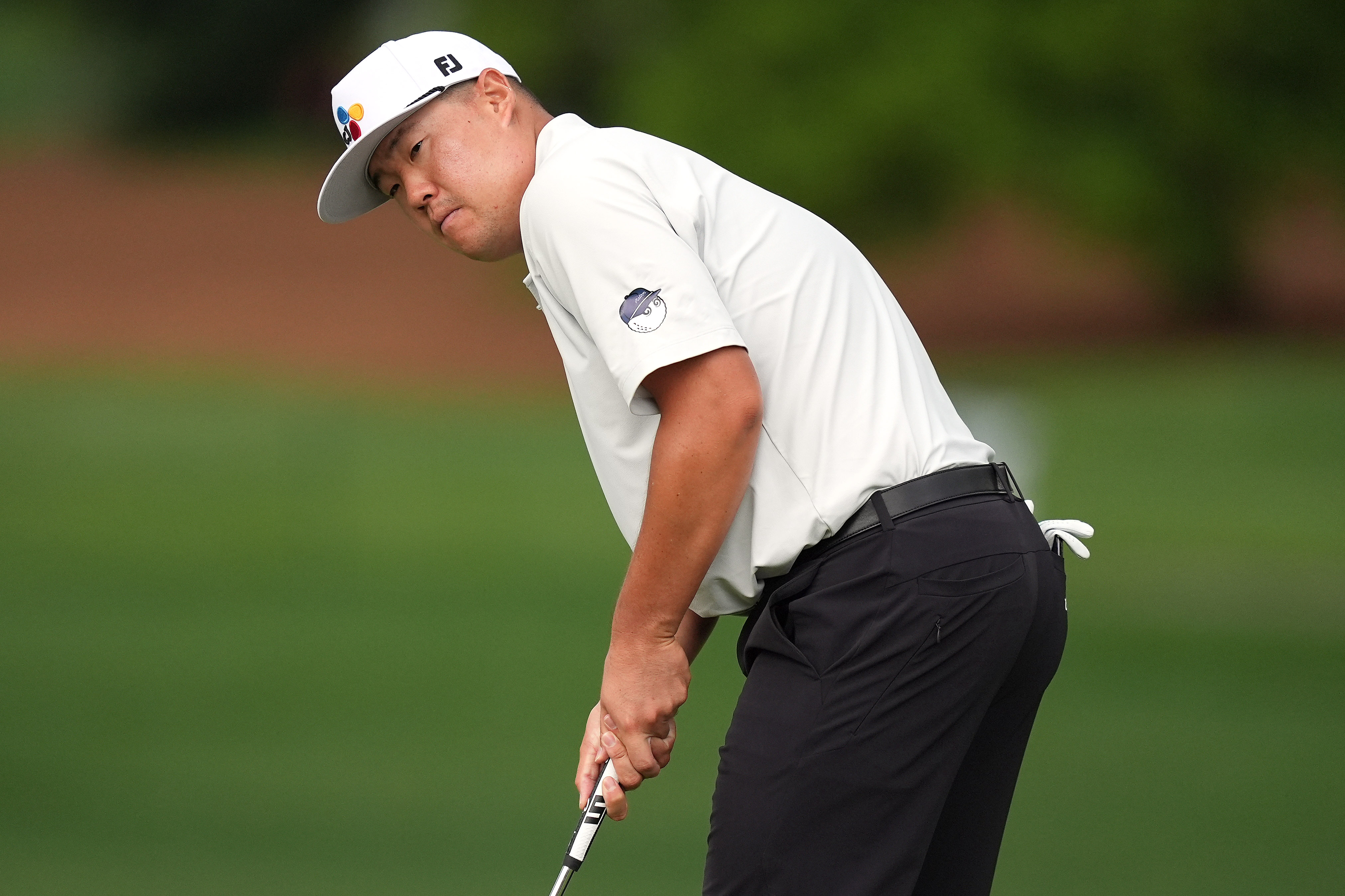 Sungjae Im watches his ball on the fifth green as we break down our Truist Championship Round 3 picks & predictions.