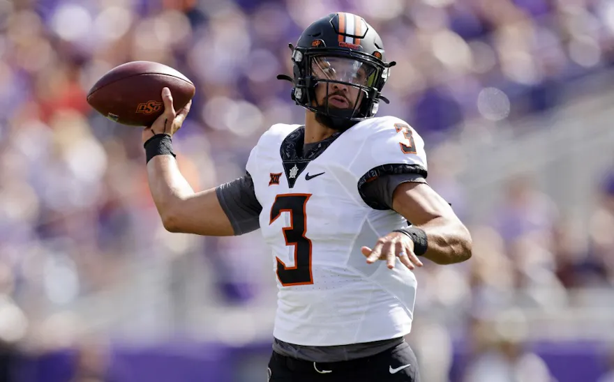 Spencer Sanders of the Oklahoma State Cowboys throws against the TCU Horned Frogs during the first half.
