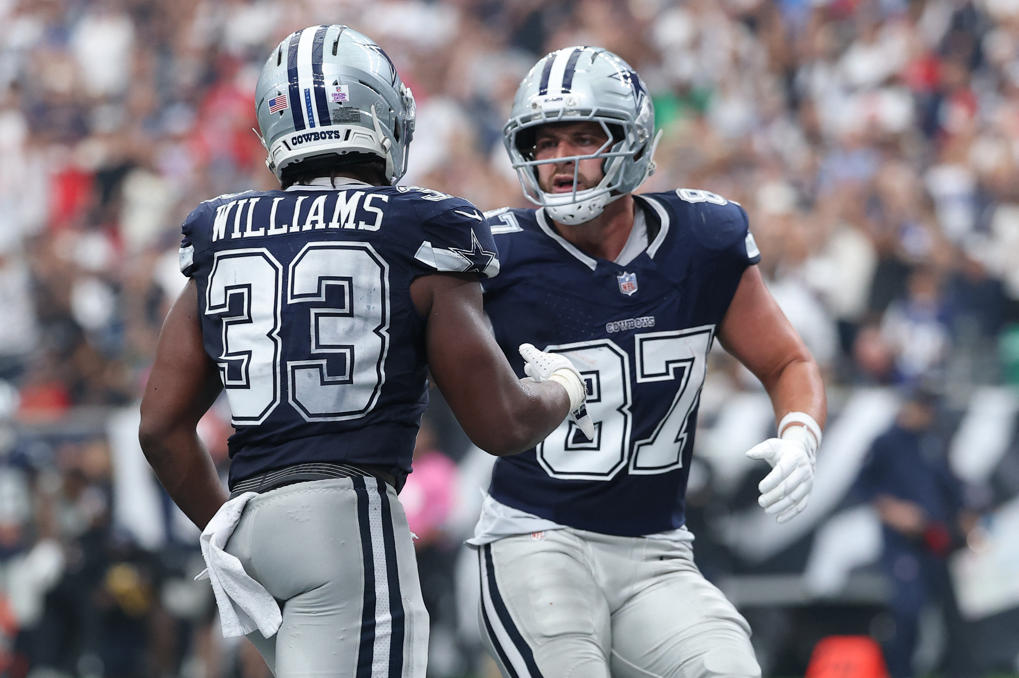 Dallas Cowboys running back Javonte Williams and tight end Jake Ferguson (87) react as we make our best Buccaneers vs. Cowboys prediction