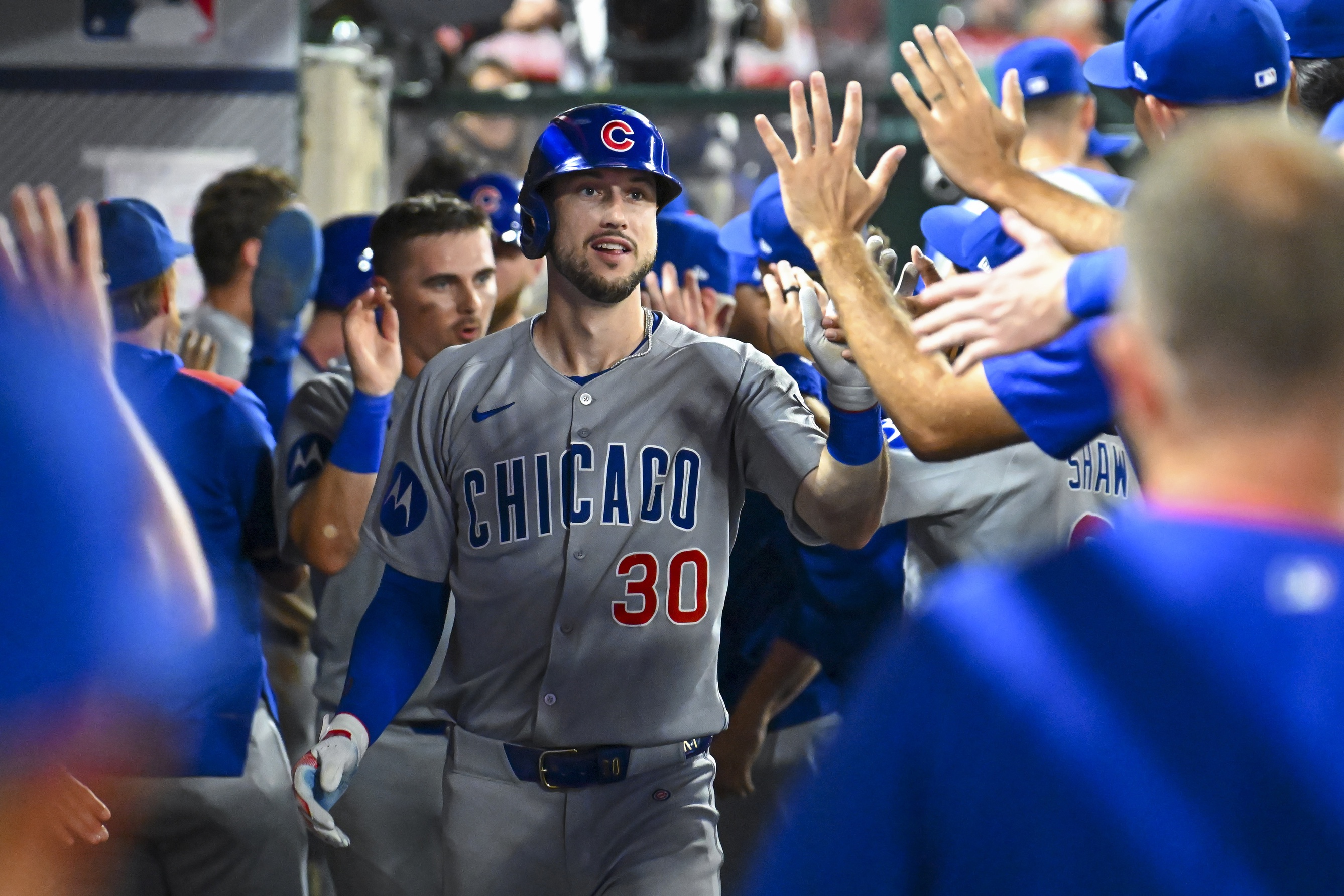 Chicago Cubs outfielder Kyle Tucker celebrates with teammates, and we're looking at his likely next team