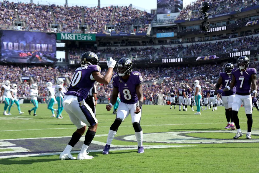 Wide receiver Demarcus Robinson of the Baltimore Ravens celebrates with quarterback Lamar Jackson after catching a touchdown pass against the Miami Dolphins at M&T Bank Stadium in Baltimore, Maryland. Photo by Rob Carr/Getty Images via AFP.