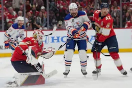 Edmonton Oilers forward Zach Hyman reaches to tip in the puck against Florida Panthers goaltender Sergei Bobrovsky as we look at the best 2024 Stanley Cup odds