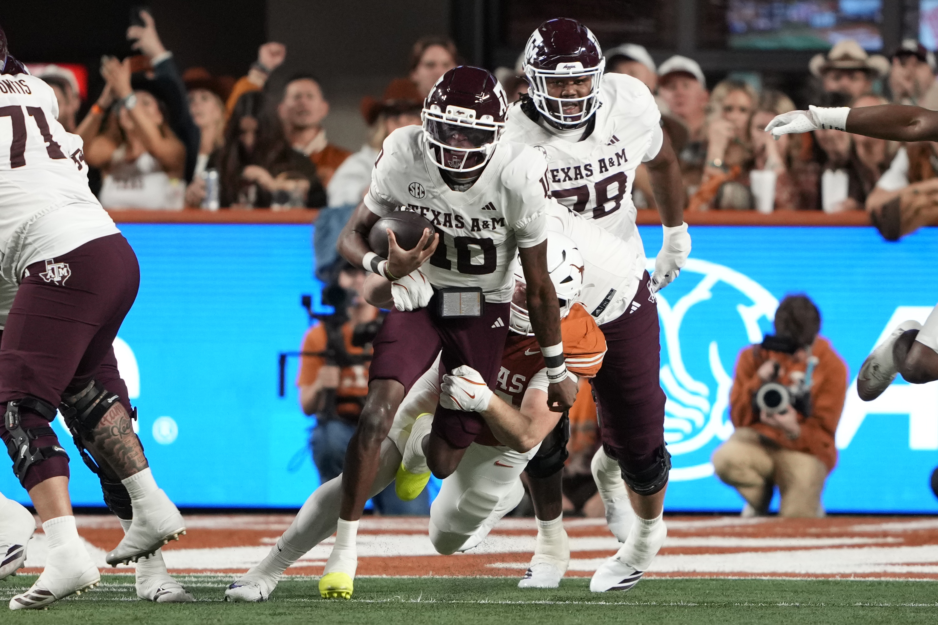 Texas A&M quarterback Marcel Reed (10) keeps the ball for yards as we look at our bowl game predictions this week
