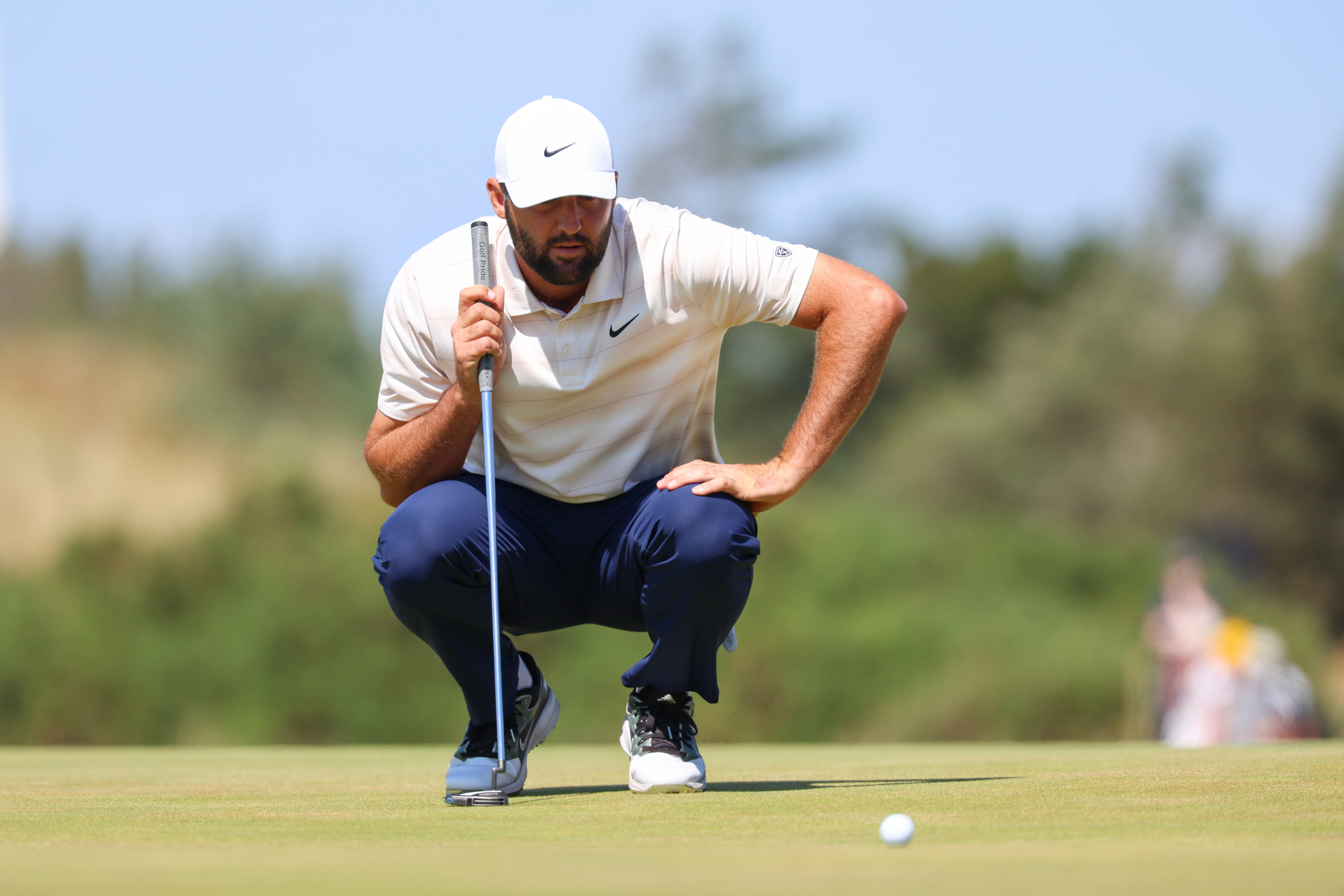 Scottie Scheffler lines up a putt on the ninth green as he is featured in our 3M Open odds, favorite & pick to win.