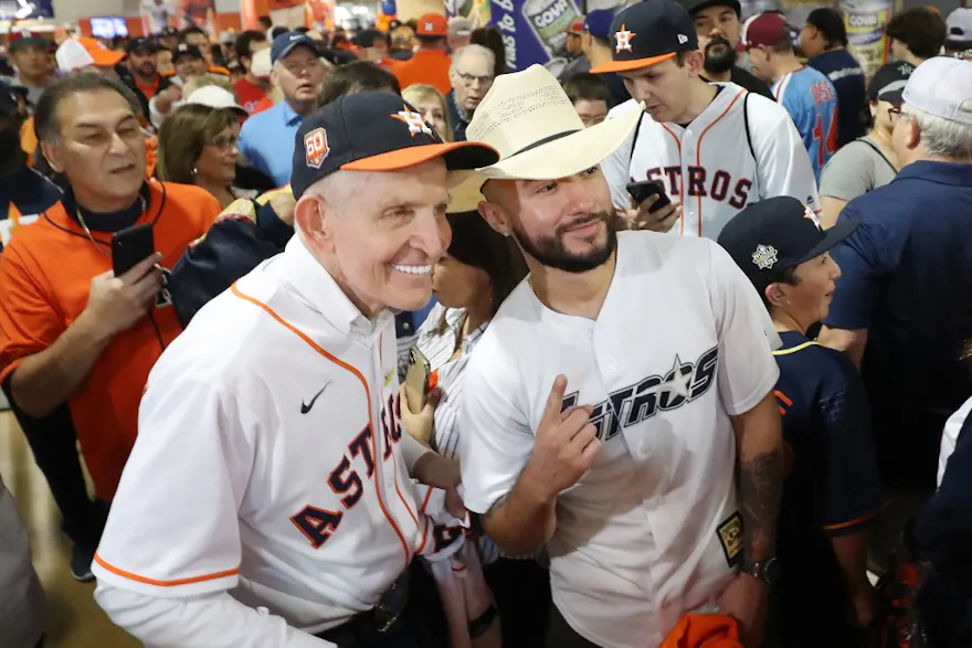 James Franklin McIngvale, also known as "Mattress Mack", poses with fans prior to Game One of the 2022 World Series between the Philadelphia Phillies and the Houston Astros at Minute Maid Park on October 28, 2022 in Houston, Texas.