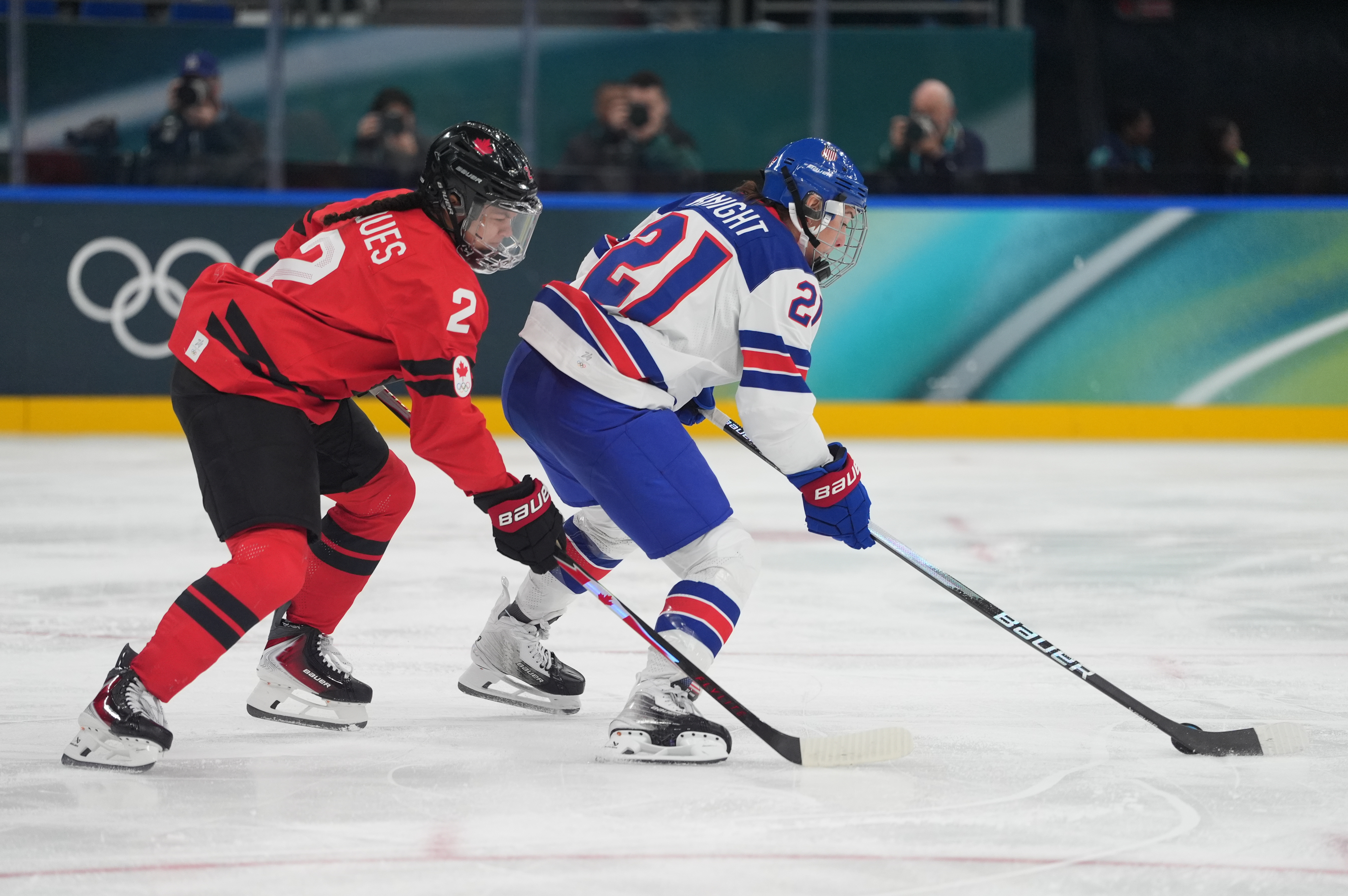 Hilary Knight - who's featured in my Canada vs. USA prediction - of the United States is defended by Sophie Jaques (2) of Canada. 